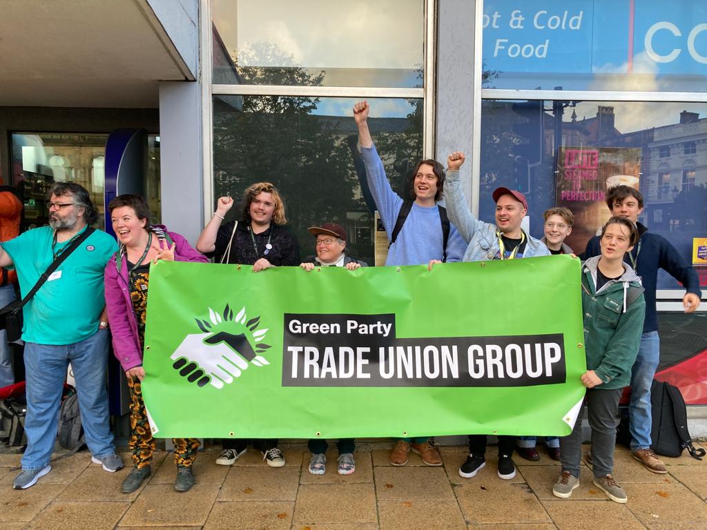 Group of Green members holding a Green Party Trade Union Group banner